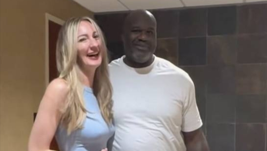 NBA球星奥尼尔与全球最高女模特会面 两人亲热相拥