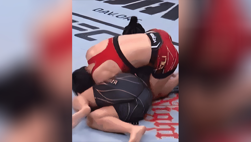 体坛记忆｜中华巾帼太能打！张伟丽两度倒地后反杀，肘击砸穿对手霸气卫冕